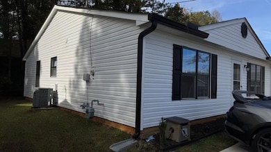 View of home's exterior featuring central AC and a