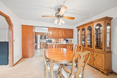 Large, light-filled dining room is open to the kitchen, living room, and 4 season porch, providing the open concept feel.