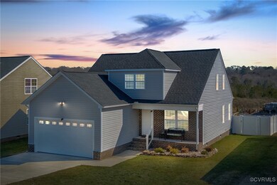 View of front of property featuring a garage and a