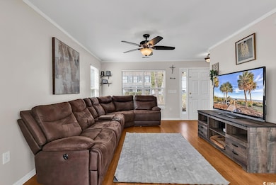 Living area featuring light wood-style flooring, b