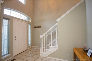 2-story entry with arched transom window.
