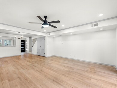 Living/Dining combo and view of front entryway