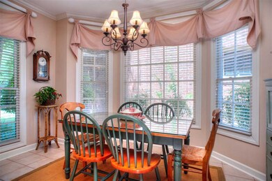 14x09 Breakfast Area with Wall   of Windows in Kit