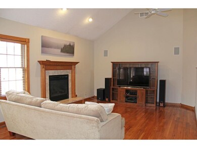 Main floor living room with gas fireplace and surr