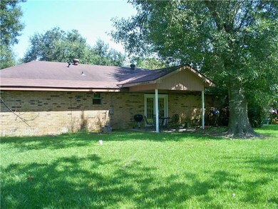 Exterior Back. Enjoy famiy gatherings on the patio