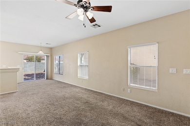 Unfurnished living room featuring carpet floors, c