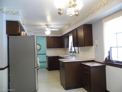 One view of Kitchen with windows allowing light in