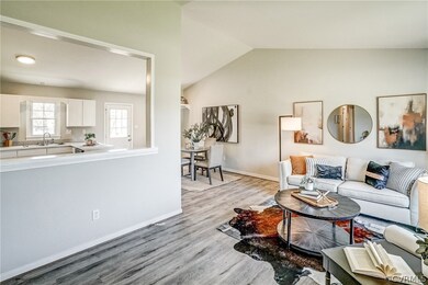 Living room featuring sink, light wood-type floori