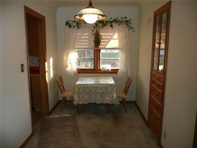 Formal dining with built-ins.  (hardwood under car