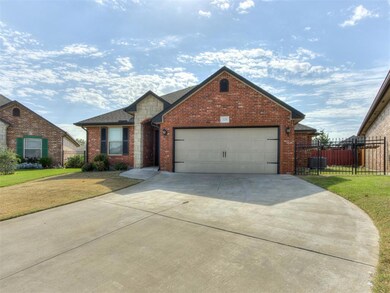 View of front of house with a front yard and a gar