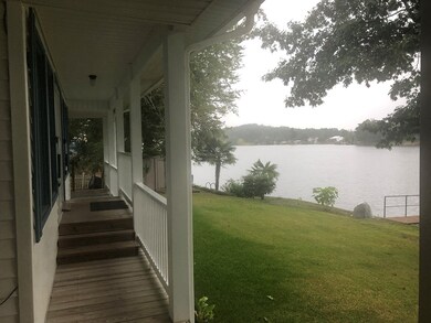 Walk way to covered porch and 2 car garage