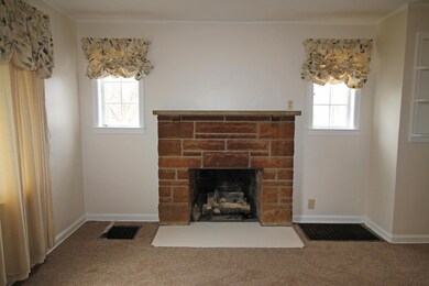 Stone front gas log fireplace
