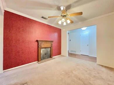 Unfurnished living room with ceiling fan, a textur