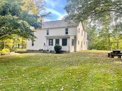 Back of the house with entry deck and heated porch