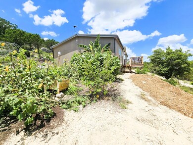 View of property exterior featuring a deck