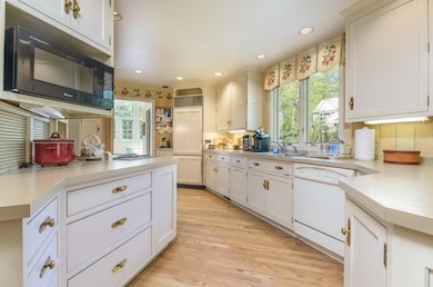 With double windows over the sink, there is a grea