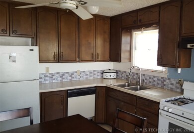 Plenty of cabinets in the kitchen w/stainless sink