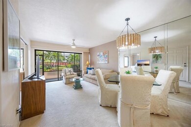 Dining space with ceiling fan with notable chandel