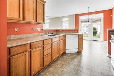 Kitchen is open to breakfast area, with breakfast bar.