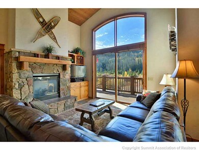 Living Room. Large windows throughout.