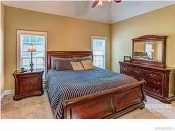 An enormous master bedroom that swallows a king be