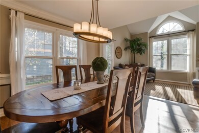 Dining Room with wood floors and crown/chair/pictu
