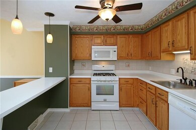 Another view of the kitchen and breakfast bar.
