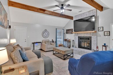 Living area featuring visible vents, light wood-st