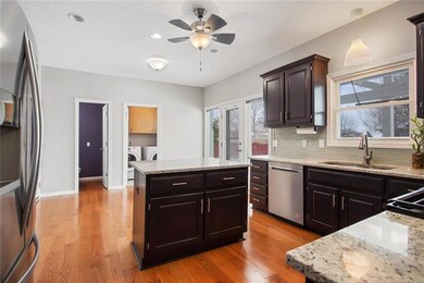 Remodeled kitchen includes new cabinetry, new gran