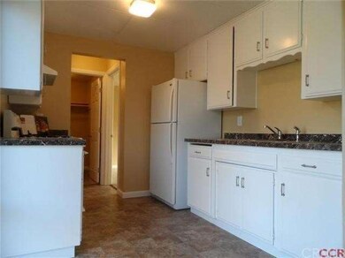 Freshly painted kitchen cabs placed on new vinyl f