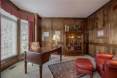 Beautiful paneled office/study/ library. French do