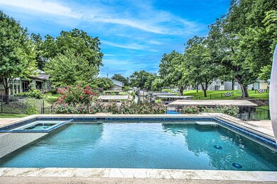View of pool featuring a pool with connected hot 