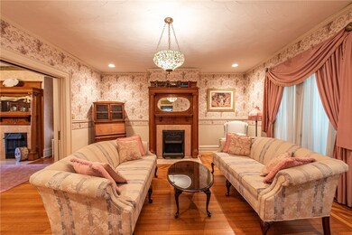 Stunning living room with original fire place.
