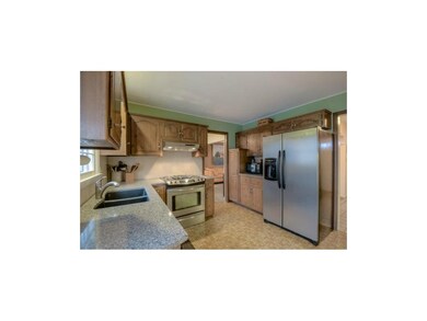 The eat-in kitchen is nice appointed with updated 