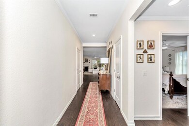 Enter through this hallway with 2 bedrooms at the front of the home.
