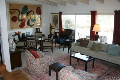 Big living room with adjacent patio and huge city 