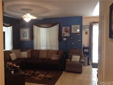 living room off dining area and gourmet kitchen
