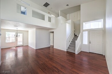 Foyer featuring visible vents, stairway, a notable