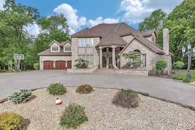 Lovely landscaping surrounds the home.