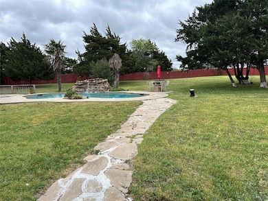 View of yard with a fenced backyard and a fenced i