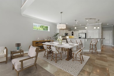 Inviting open-concept kitchen and dining area designed to effortlessly host lively dinner parties and intimate gatherings.