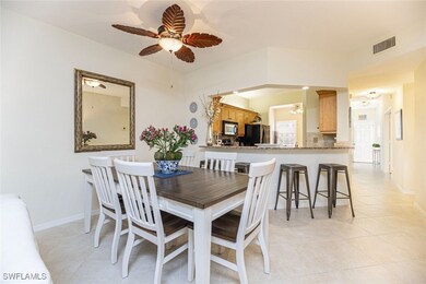 Dining area featuring light tile patterned floorin