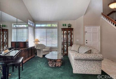 LIVING ROOM AND ENTRY AREA. 