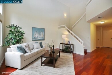 Hardwood  flooring extends all the way up the stai