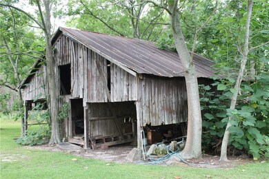 old farm barn on back of property
