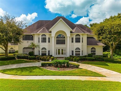 Front of home in private gated 21 home community with sidewalks 