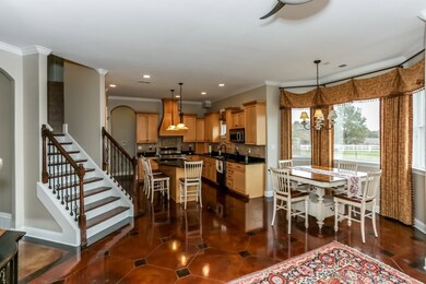 The gourmet kitchen and breakfast area opens to th