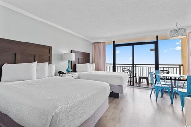 Bedroom featuring light wood-style flooring, floor to ceiling windows, a textured ceiling, crown molding, and access to outside