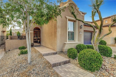 View of front of house featuring a gate, stucco si