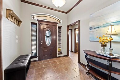 Tiled entryway featuring a wealth of natural light
